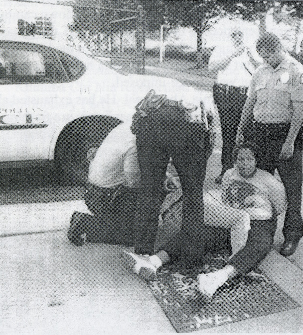 Janey Archey (CAPCR) and JuJu Jacobs (OBS) get handcuffed at scene of convention boycott protest.